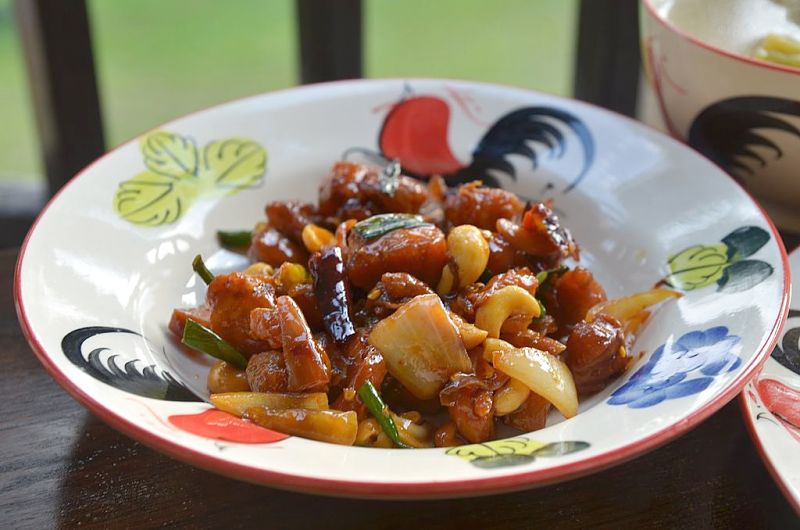 Thai Kung Pao chicken, fried with whole dried chillies and with tamarind in the sauce